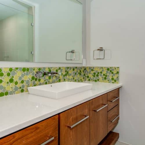 New luxury bathroom with green accent