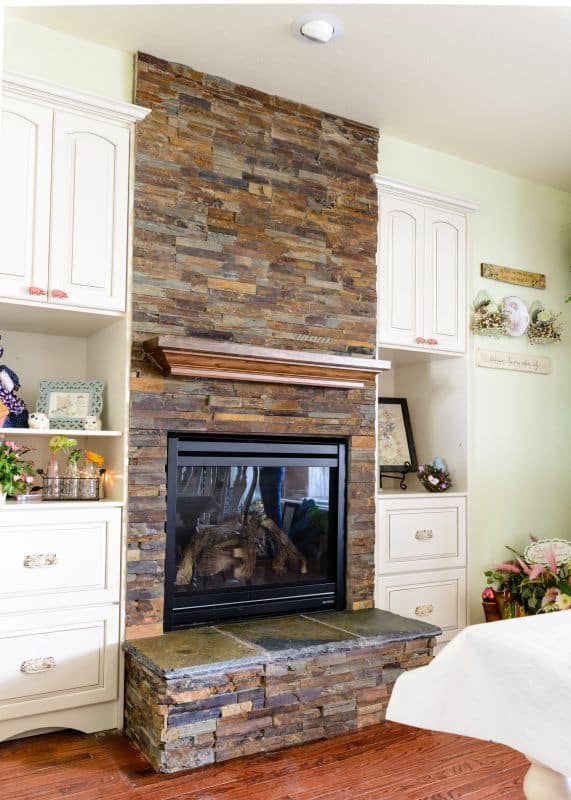 fireplace with mantle and side cabinets